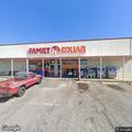 Suspicious man in burgundy truck at Family Dollar