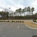 Elderly woman slumped over in car at hotel