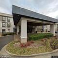 Unoccupied running truck reported at hotel lot