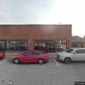 Person pacing outside business on Maxwell Street
