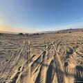 Person experiencing back pain near Oceano Dunes
