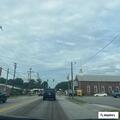 Woman arguing and throwing items in street dispute