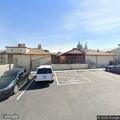 Officer checks audible alarm at business