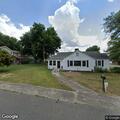 Person experiencing difficulty breathing at home