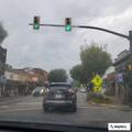 Caller reports unsafe driver in white sedan