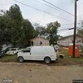 Man on mini bike trespasses and looks through yard items