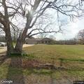 Tree limb hanging into roadway on West Side Road