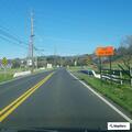 Younger male riding dirt bike along Hensley Road