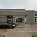 Female lying on ground in McDonald's parking lot