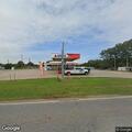Officer checks vehicle at Sunoco parking area
