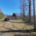 Tree reported on house on Poplar Cove Drive