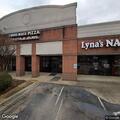 Car hits restaurant building on Arlington Road