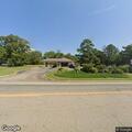 Male subject rolling on grass at bank in Pottsville