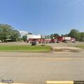 Officer checks vehicles near Centennial Bank