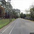 Two-car crash with damaged utility pole