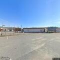 Suspicious people near vacant building with flashlights