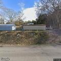 Woman taking mail from mailboxes and walking away