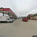 Officer checks white Lincoln at Paris gas station