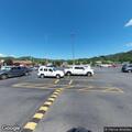 Man yelling at people at Ingles picnic tables