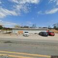 Person with breathing difficulty in red Nissan at Dallas store
