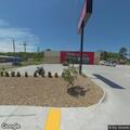 Officer contacts white Dodge pickup at auto store