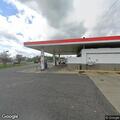 Woman conscious with abdominal pain at gas station