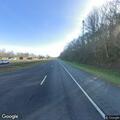 Traffic crash with fluid spill on roadway