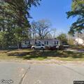 Tree branches on roof at Old Mill Road home