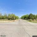 Tree branch blocking road near intersection