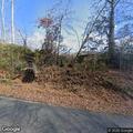 Tree leaning over roadway on Camp Elliott Road