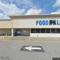 Officer conducts business check at Food Lion