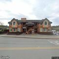 Person with stomach pain near Main Street in Cambria