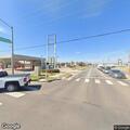 Slow-moving sedan causes traffic hazard