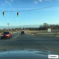Group yelling at passing driver near country market