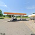 Man found unconscious in running vehicle at gas station