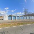 Abandoned vehicle crashes into storage unit barrier