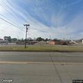 Unconscious woman breathing at gas station
