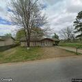 Unwanted person with small fire in front yard
