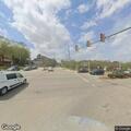 Driver with emergency lights stopped at hospital