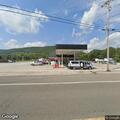 Officer checks vehicle at Big Apple parking lot