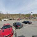 Vehicle scrapes pavement in municipal parking lot