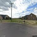 Person experiencing abdominal pain at residential address