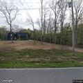 Vehicle crash with car on its side in ditch