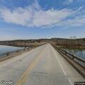Fire crew inspects unidentified substance at bridge