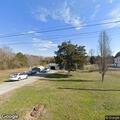 Vehicle crash with overturned car in yard