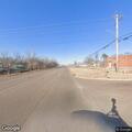 Trailer load falls and hits parked vehicle
