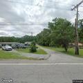 Minor vehicle crash in driveway on Airport Road