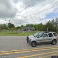 Traffic stop on blue Ford Mustang near library