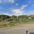 Grass fire threatening home near Avenue 92