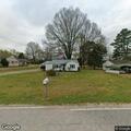 Neighbor driving truck through yard and across ditch